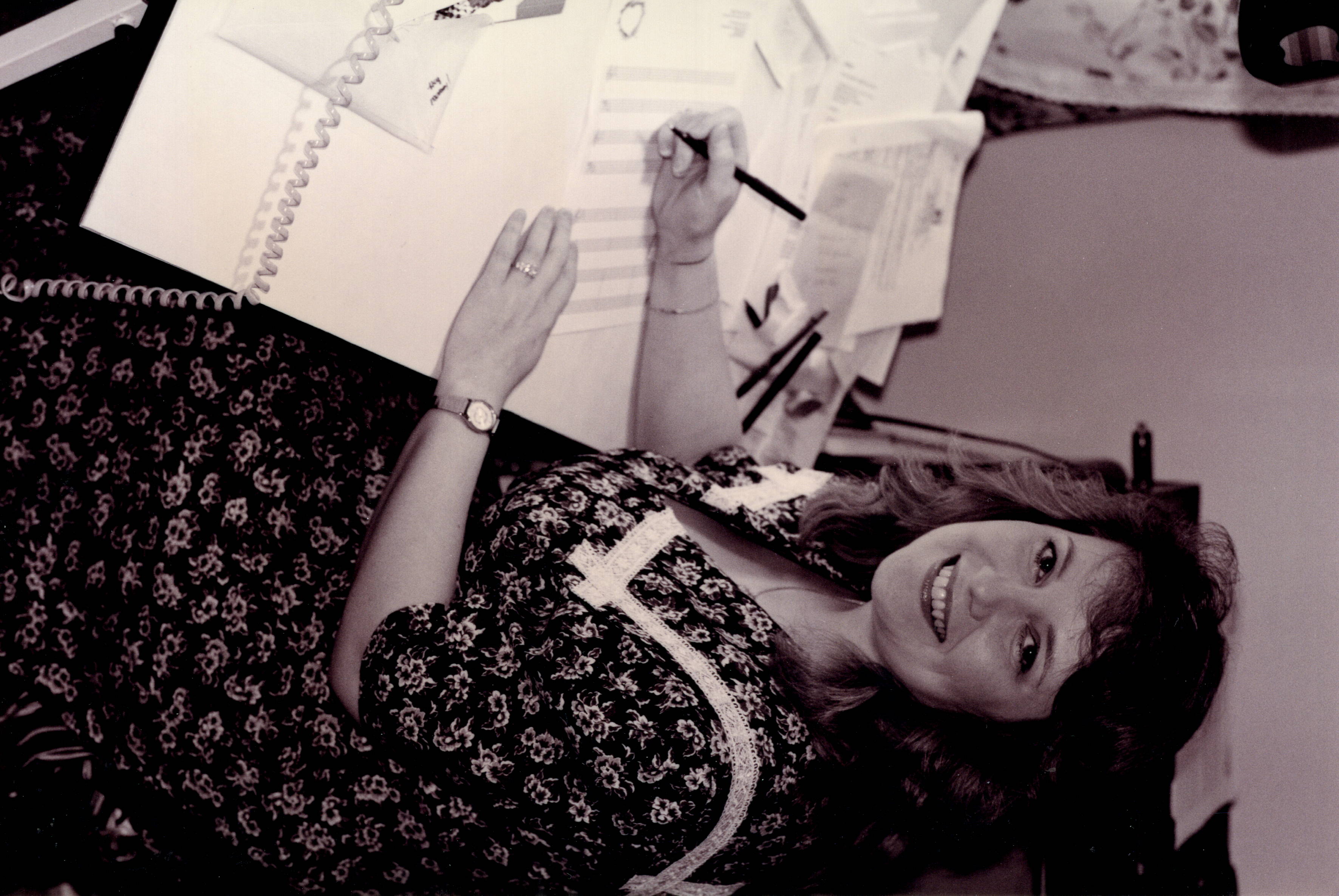 Ruthie composing at her desk